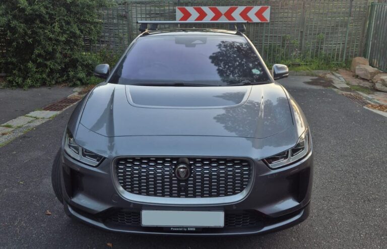Jaguar SUV sitting on the curb